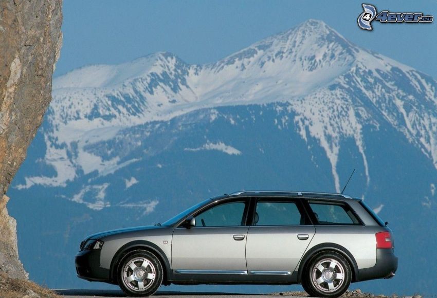 Audi A6 Allroad, snöklädda berg