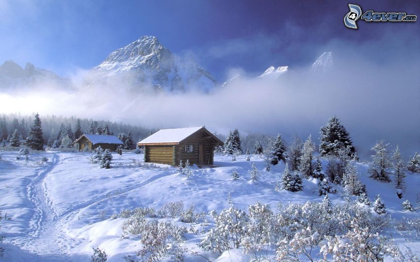 översnöade stugor, snöigt landskap, klippiga berg