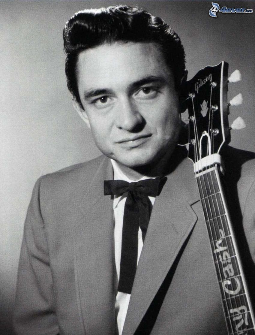 Johnny Cash, man med gitarr, svartvitt foto