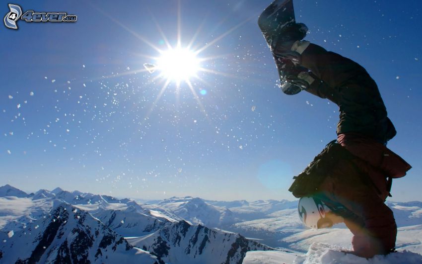 snowboarding, snöklädda berg, sol