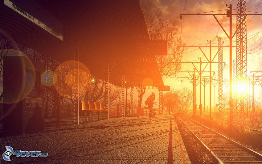 La estación de tren, andén, salida del sol