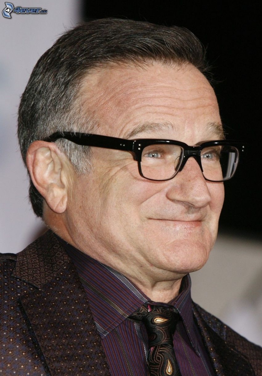 Robin Williams, homme avec des lunettes, sourire, homme en costume