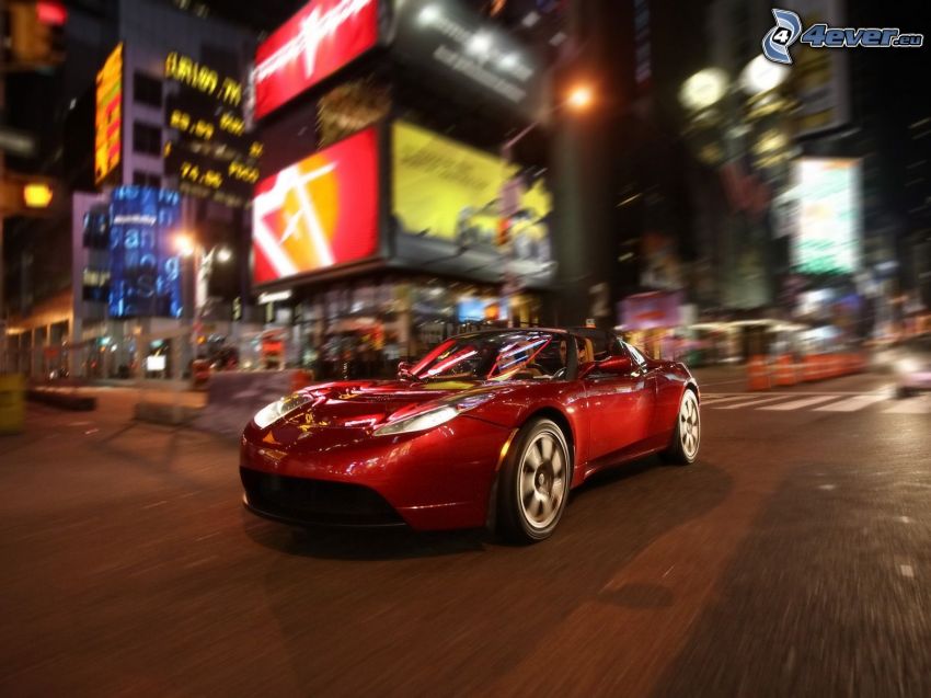 Tesla Roadster, ville dans la nuit, croisement des routes