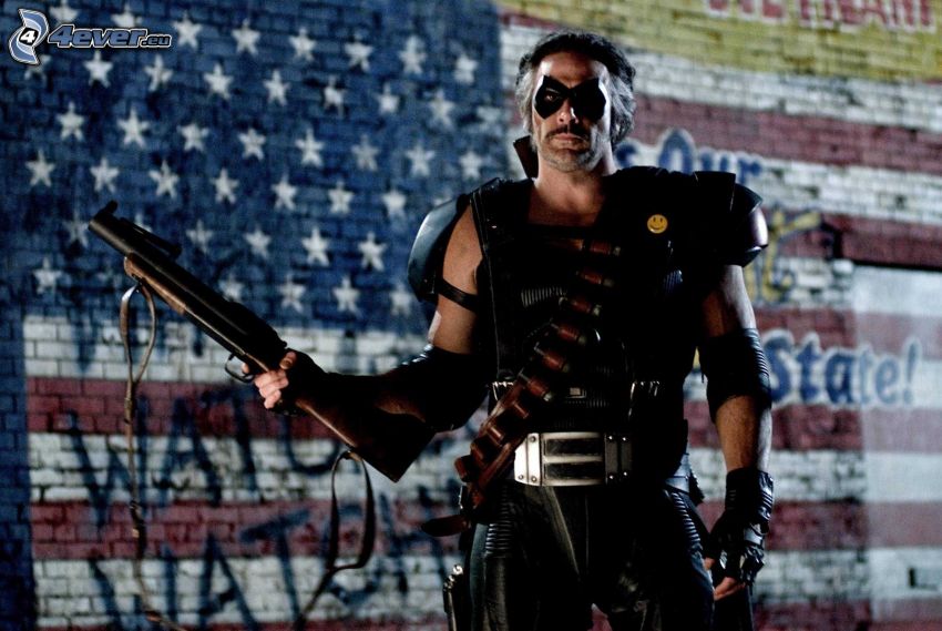 Before Watchmen, uomo con un fucile, la bandiera degli Stati Uniti