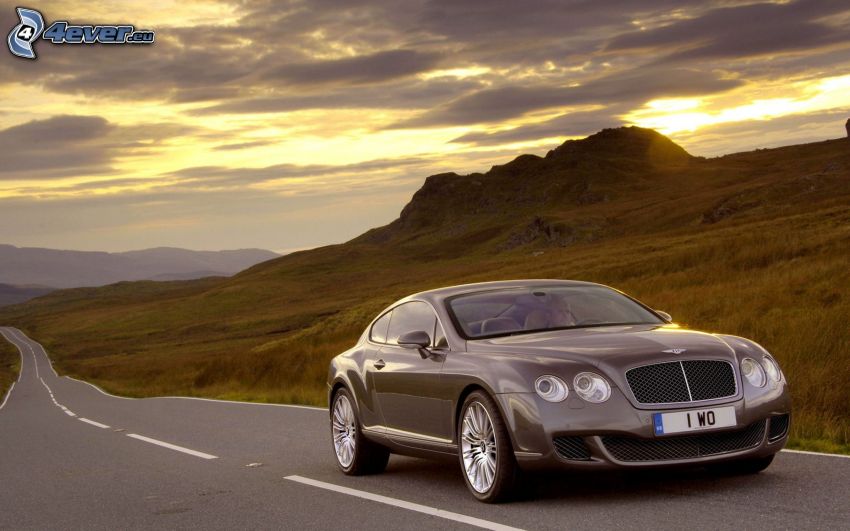 Bentley Continental, collina, sole dietro le nuvole, strada