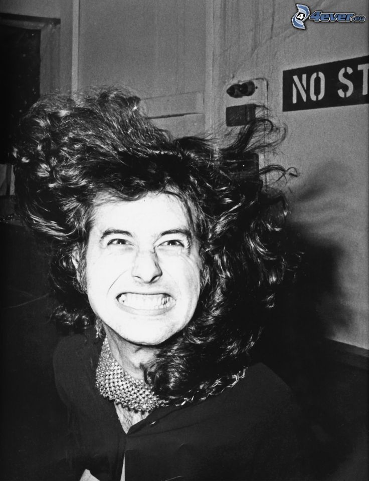 Jimmy Page, gitáros, nevetés, grimaszok, fiatalon, fekete-fehér kép