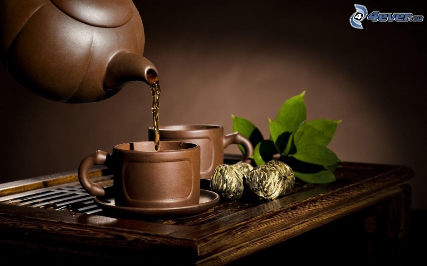 teáskanna, egy csésze tea, virágzó tea