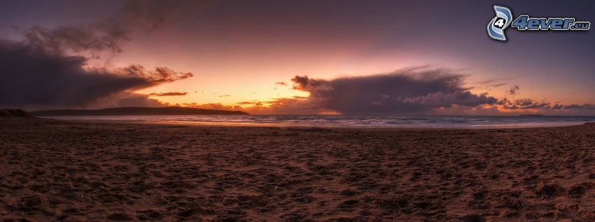 strand napnyugta után, homokos tengerpart