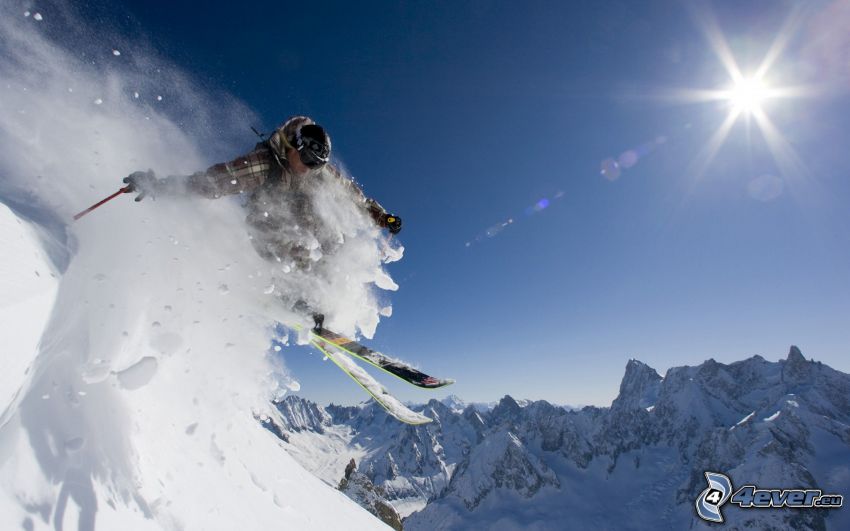 narciarstwo ekstremalne, skok na nartach, zaśnieżone góry, słońce