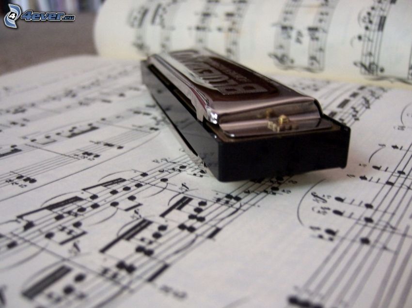 harmonica, sheet of music