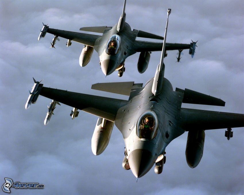 a squadron of F-16, clouds