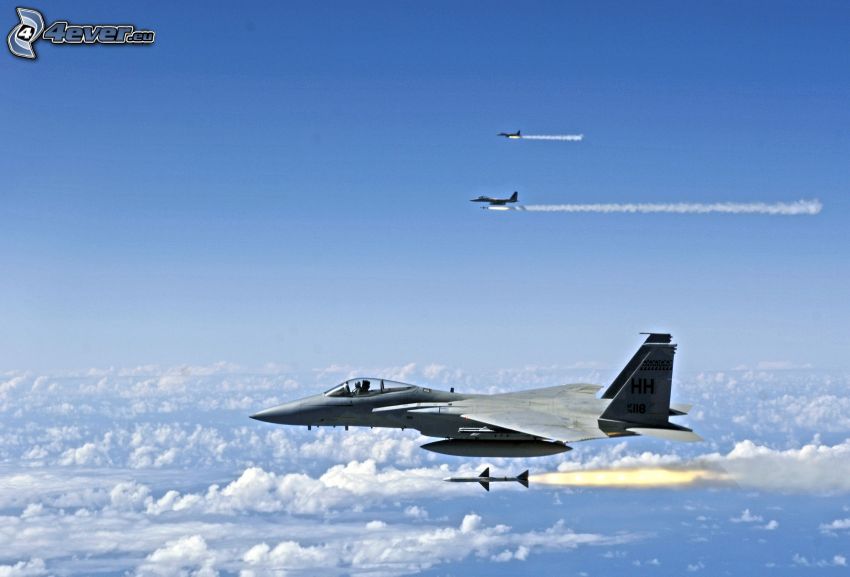 Fleet of F-15 Eagle, clouds, missile