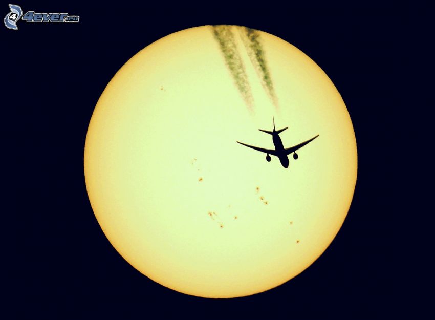 Boeing 777, silhouette of the aircraft, sun