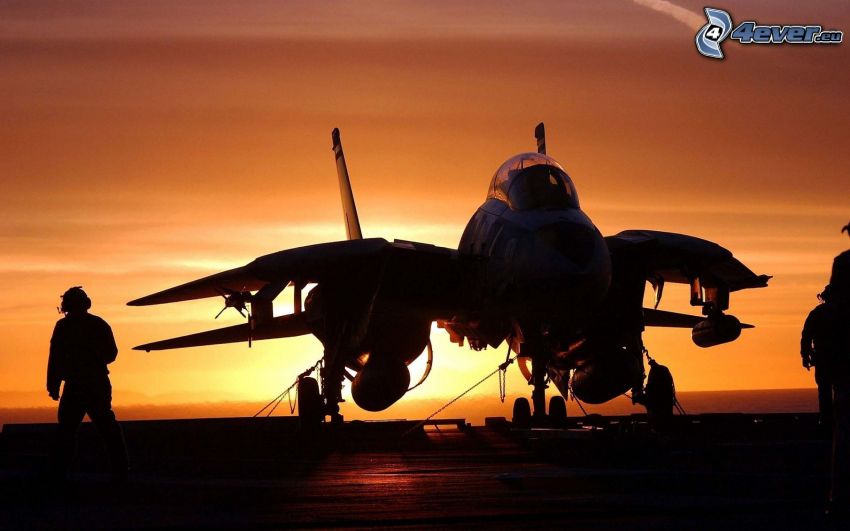 plane at sunset, silhouette of a man