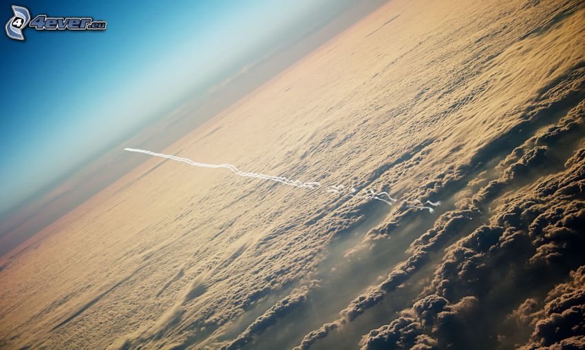 contrail, over the clouds