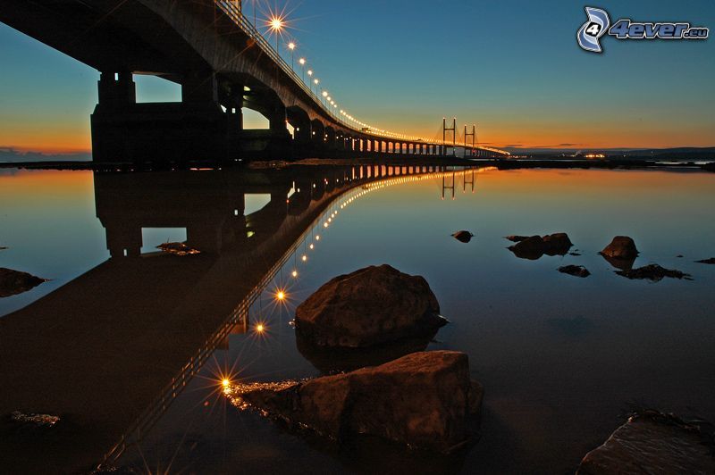 Severn Bridge, lighted bridge, rocks, after sunset