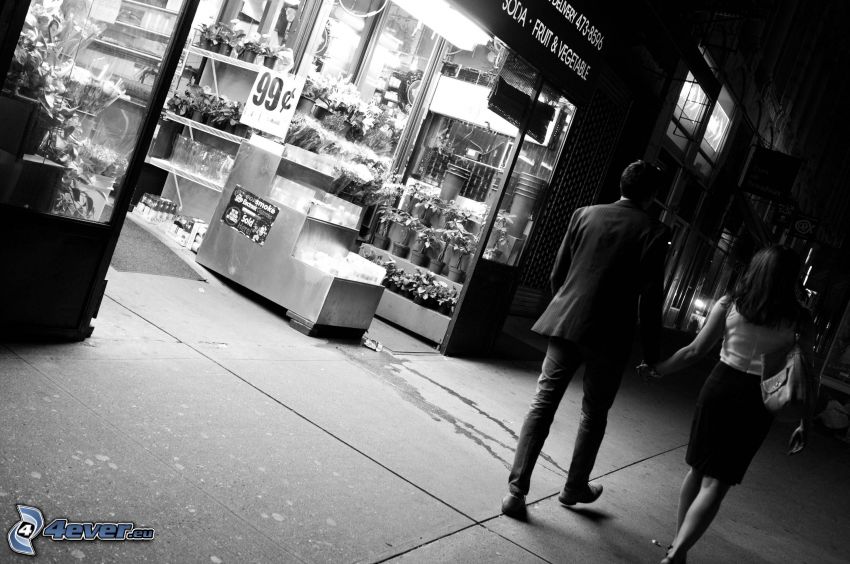couple in town, walking, street, black and white