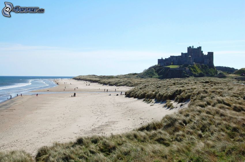 Bamburgh castle, sandy beach, sea