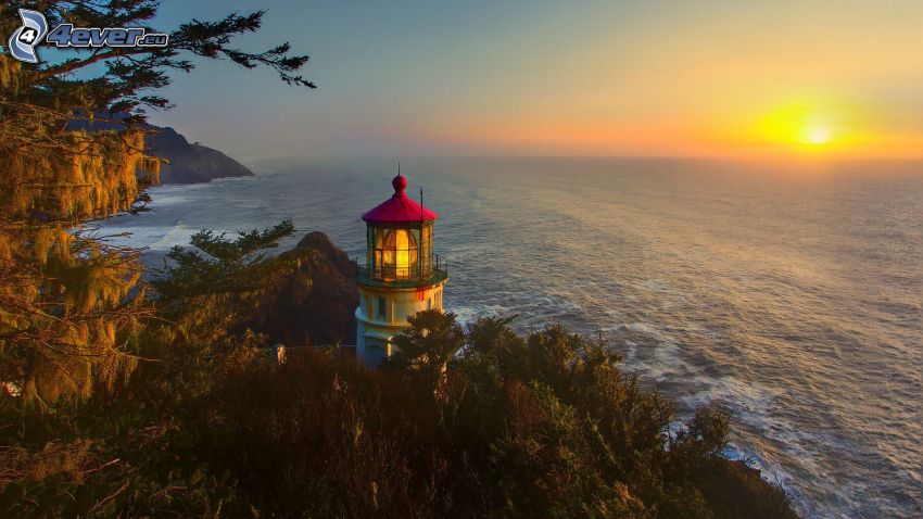 lighthouse at sunset, the view of the sea