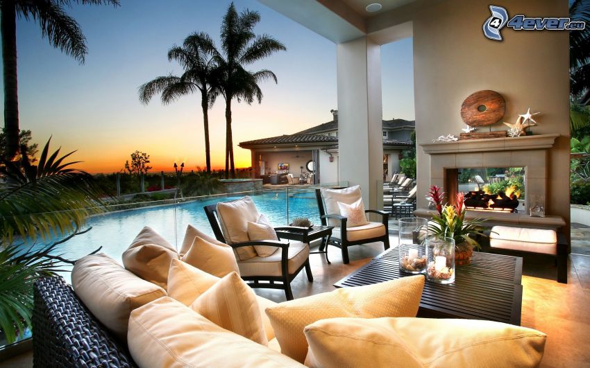 luxurious living room, pool, fireplace, palm trees