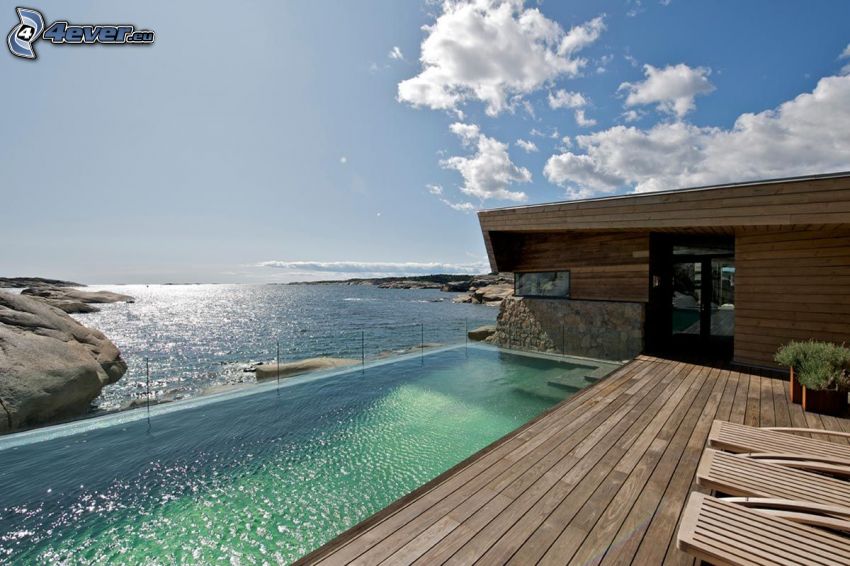 luxury house, open sea, rocky shores