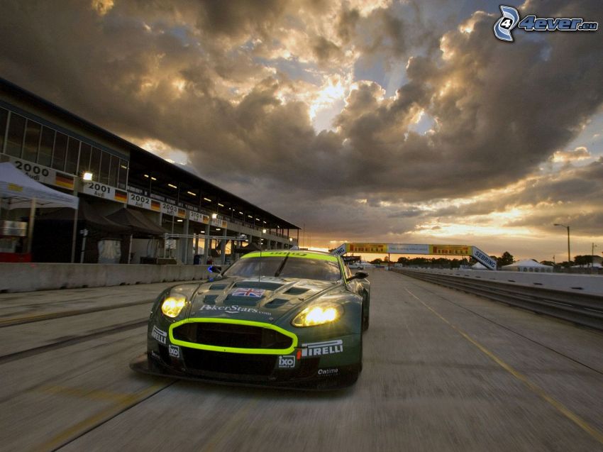 Aston Martin DB9, clouds, racing circuit