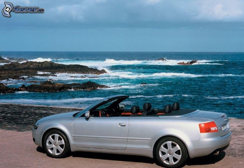 Audi A4, convertible, rocks in the sea