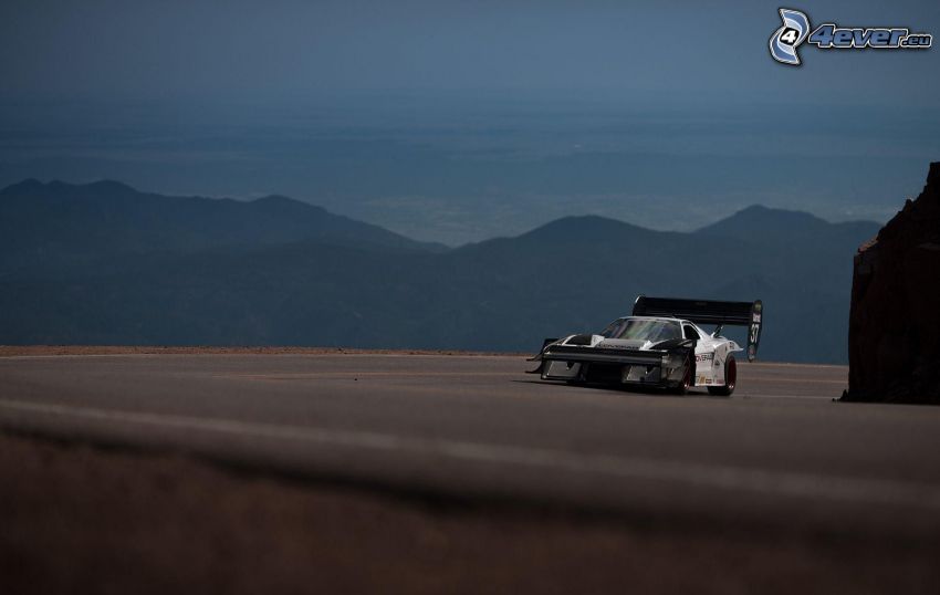 racing car, hills