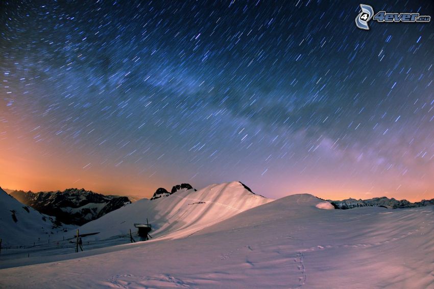 snowy hills, stars, Earth's rotation