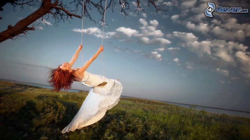 women on a swing, clouds, meadow