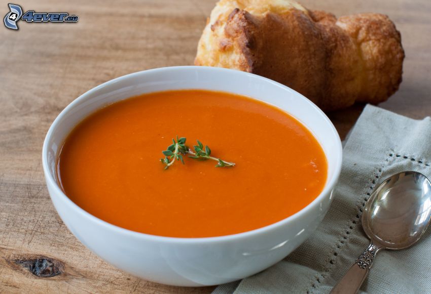 tomato soup, bread, spoon