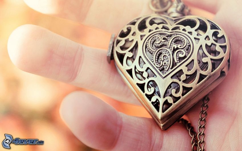 silver pendant, hand, heart
