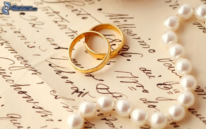 wedding rings, pearl necklace, text