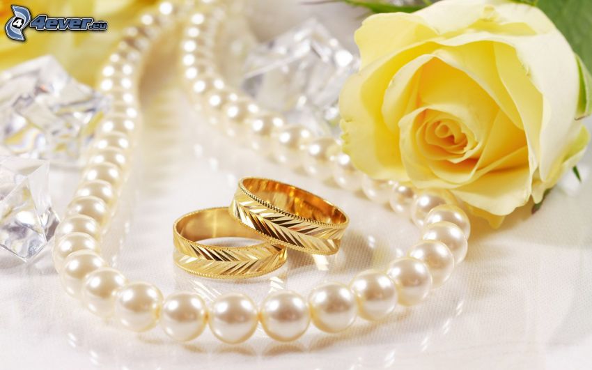 wedding rings, pearl necklace, Yellow roses