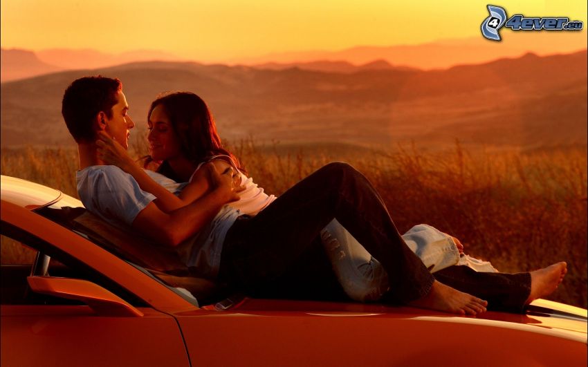 couple at sunset, car