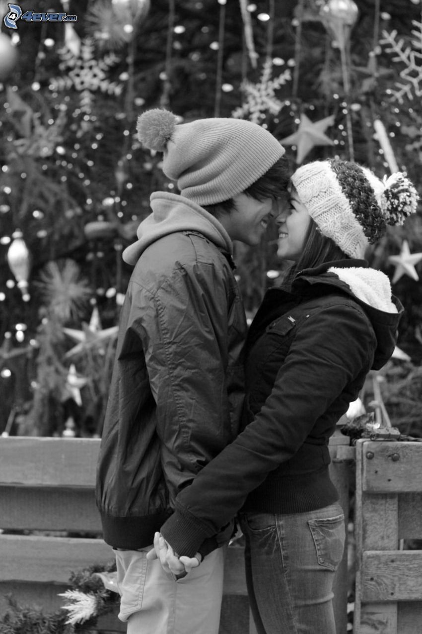 couple in embrace, snowflakes