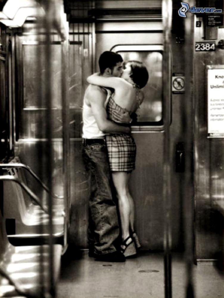 couple in embrace, subway