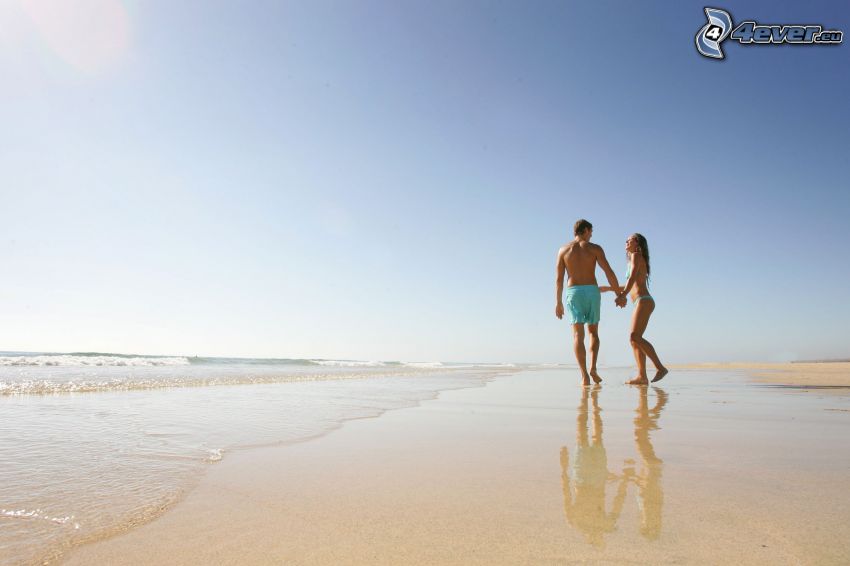 couple on the beach, sea, blue sky