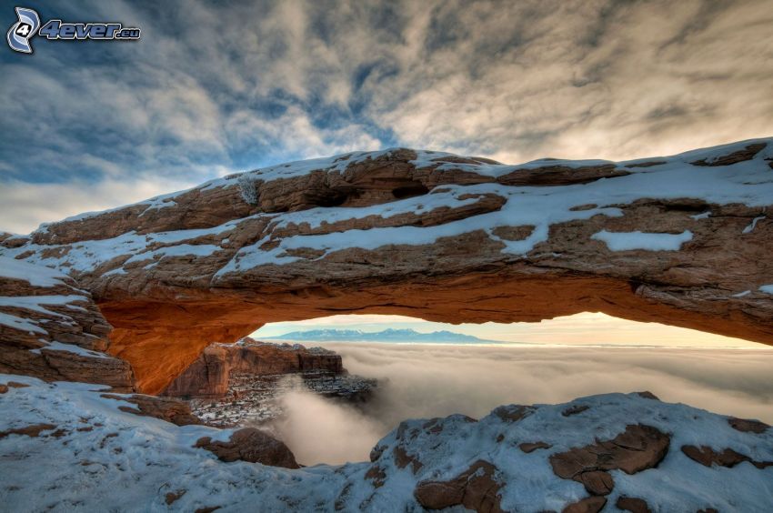 Mesa Arch, natural stone gate, snow