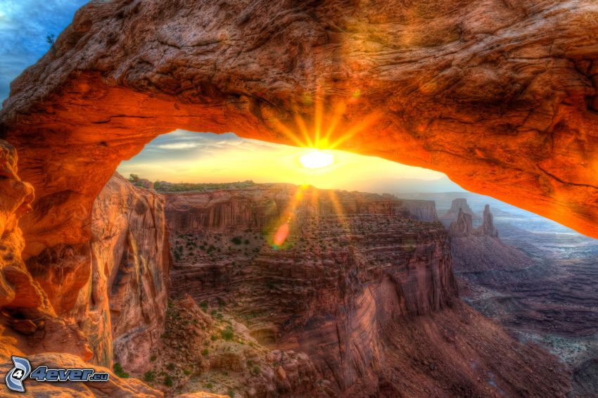 Mesa Arch, natural stone gate, view of rocks, sunset