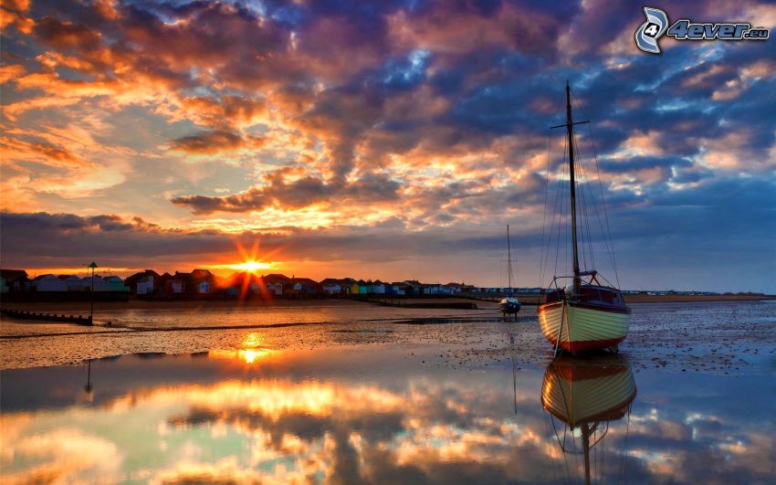 beach at sunset, sailing boat, clouds, low tide