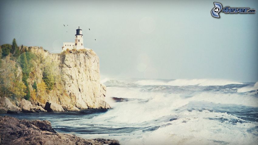 coastal reefs, lighthouse on a cliff, stormy sea