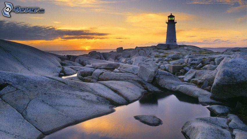 lighthouse, rocks, sunset behind the sea