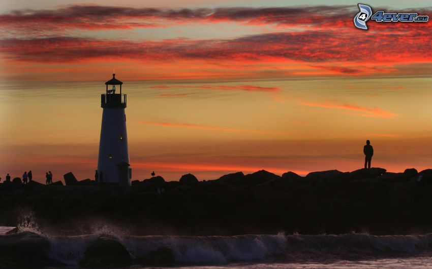 lighthouse, silhouette of a boy, evening sky, rocky coastline