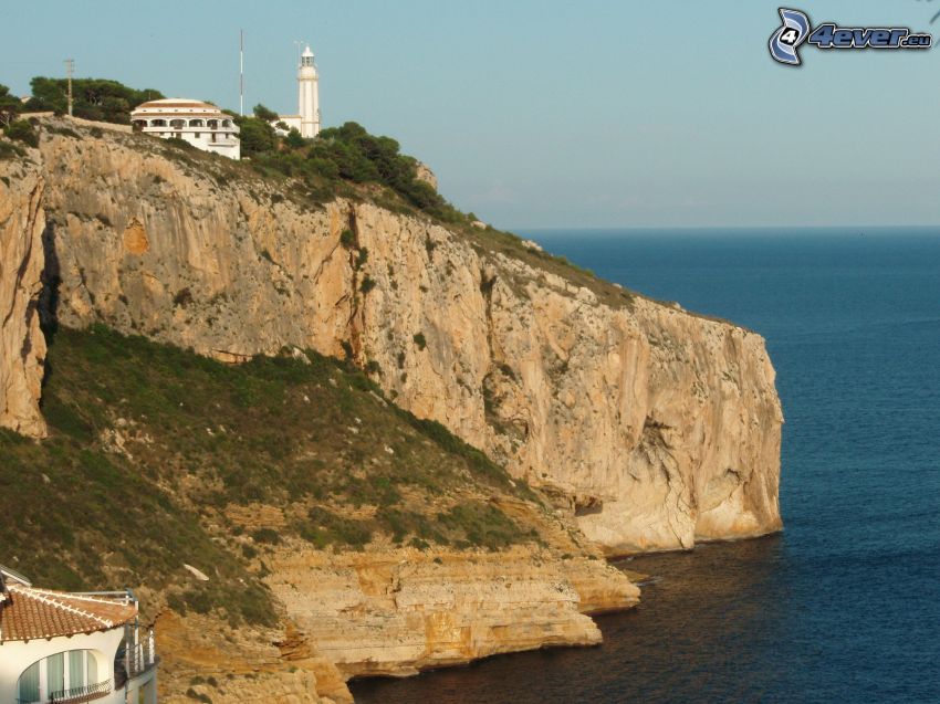 lighthouse on a cliff, sea