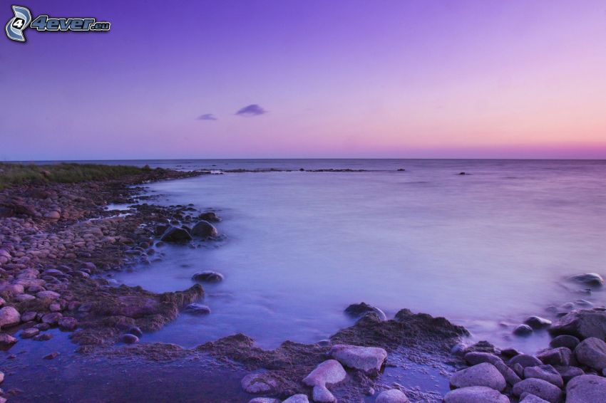open sea, purple sky, rocky shores