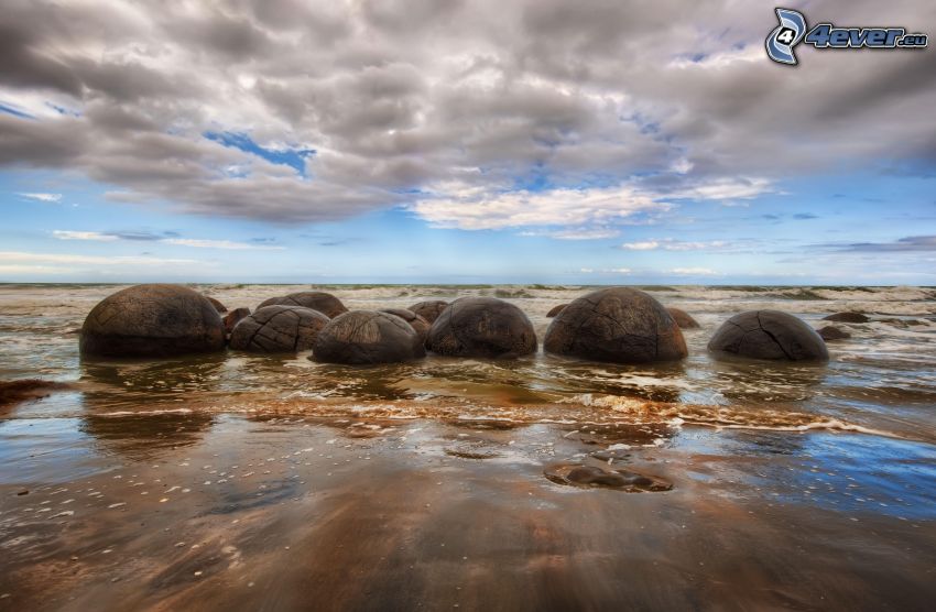 rocks in the sea, clouds