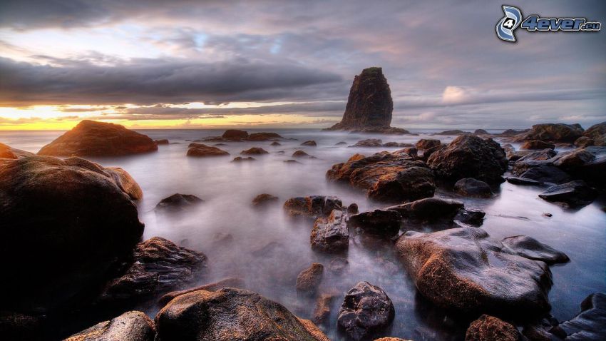 rocks in the sea, sunrise