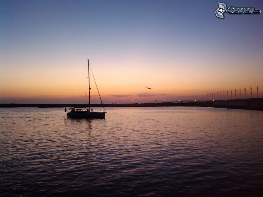 sailing boat, sea, beach after sunset