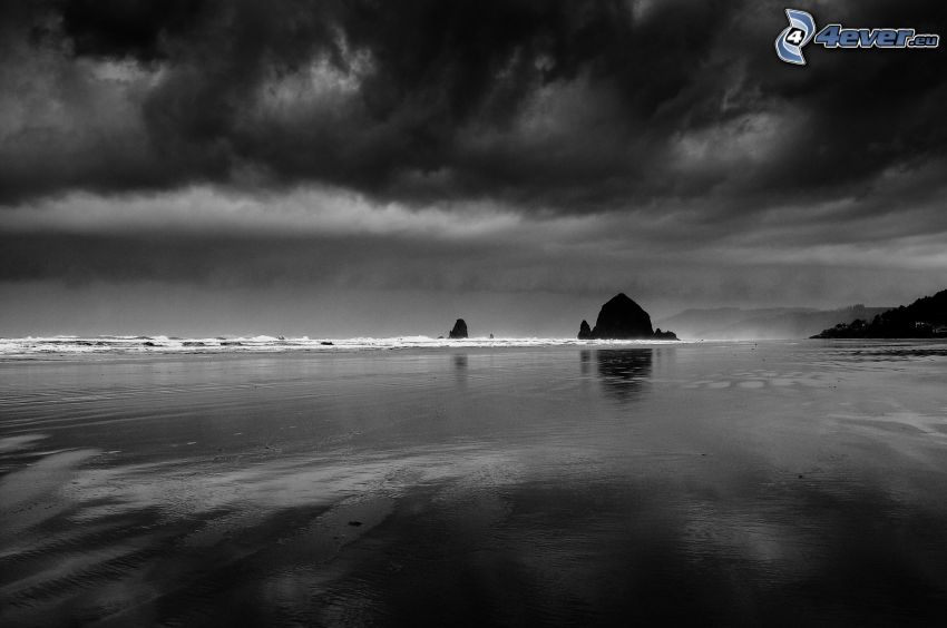 sea, clouds, rocks in the sea, black and white